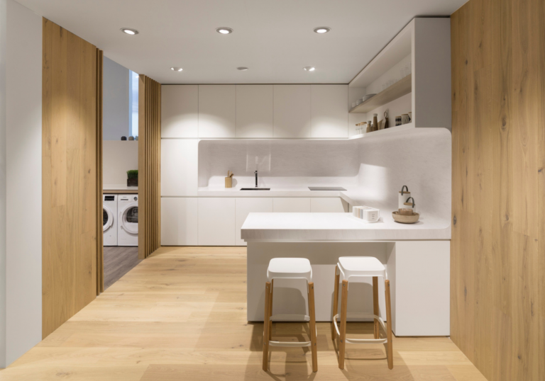 Solid Surface Seamlessly Transitions Into A Full Height Splashback